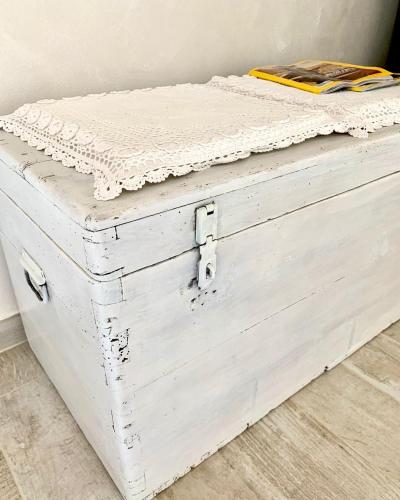 a white chest with a mattress on top of it at La Vista del Poggio in Castellaro
