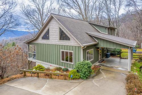 a green house with a gray roof at Mountain-View Hideaway in Waynesville
