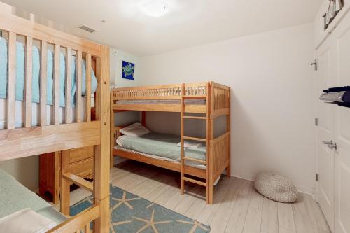 a bunk bed room with two bunk beds at The Sanctuary - Dolphins and Daiquiris 110A in Virginia Beach