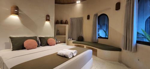 Tempat tidur dalam kamar di Tiu Oasis Lombok