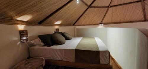 Tempat tidur dalam kamar di Tiu Oasis Lombok