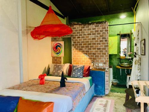 a bedroom with a bed in a room at Artist's Place Trat in Trat
