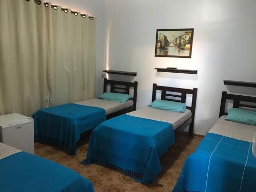 מיטה או מיטות בחדר ב-Recanto do Carreiro