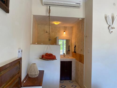 a bathroom with a sink and a mirror at Hotel La Piazzetta in Mérida