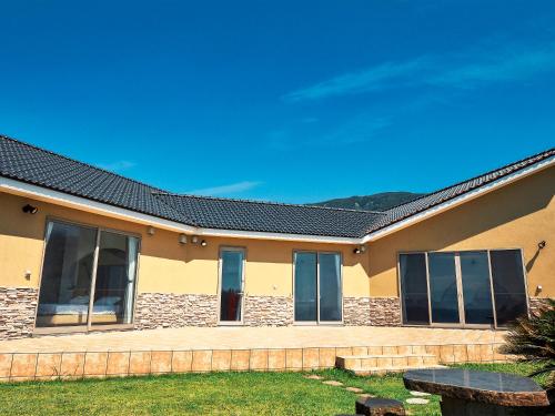 a house with windows and a roof at Resort villa miko in Oshima