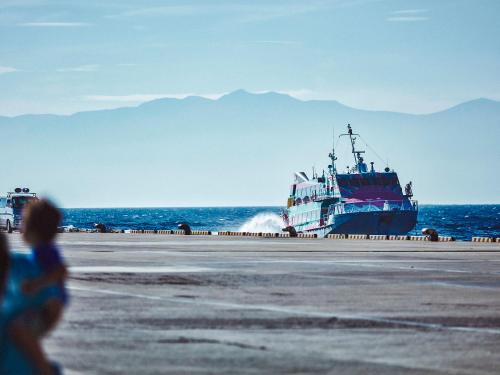 a large boat is sitting on the beach at Resort villa miko in Oshima