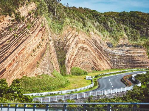 a winding road on the side of a mountain at Resort villa miko in Oshima
