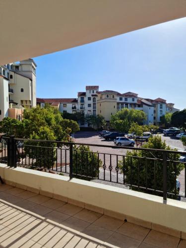 a balcony with a view of a parking lot at Island Club by Smart City Stays in Cape Town
