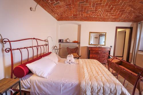 Säng eller sängar i ett rum på La casa di Chiara
