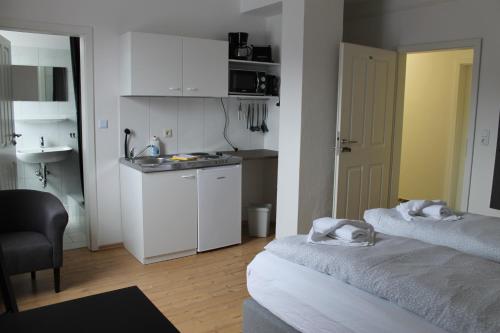 Kuchyň nebo kuchyňský kout v ubytování Boardinghouse Georgsheil