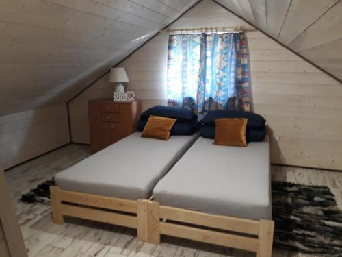 Ліжко або ліжка в номері W Krainie Okiennic