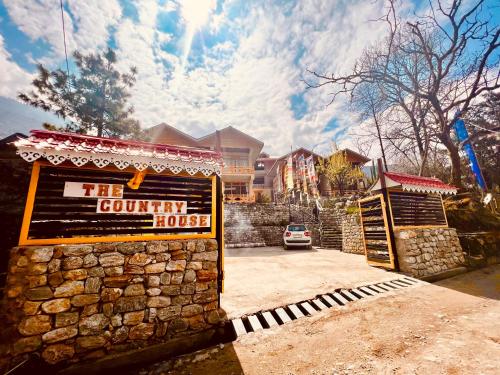 a sign for the country house in front of a house at The Country House by Trekocity in Lachung
