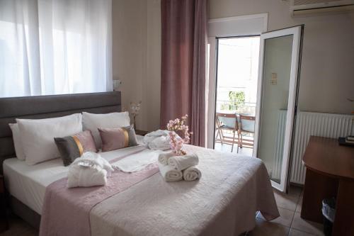 Postel nebo postele na pokoji v ubytování Hotel Karagianni