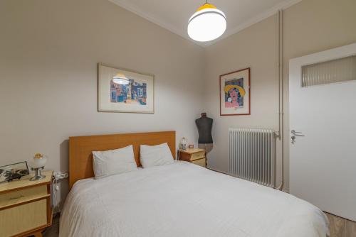 Posteľ alebo postele v izbe v ubytovaní Vintage-style Garden Apartment