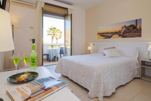 Кровать или кровати в номере Hotel Jonio
