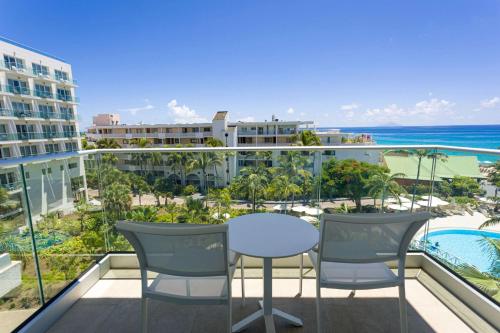 a view from a balcony overlooking the ocean at Sonesta Maho Beach All Inclusive Resort Casino & Spa in Maho Reef