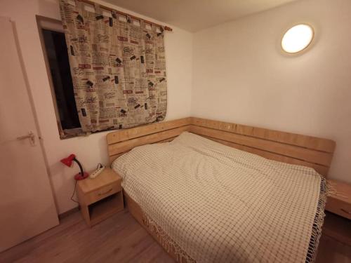 מיטה או מיטות בחדר ב-Cabanuta Fara Fite