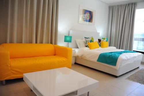 Una cama o camas en una habitación de Prime Hotel