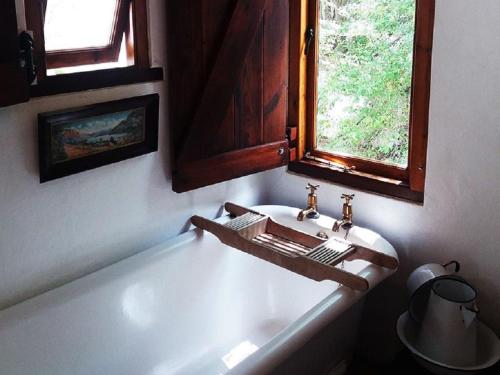 a bathroom with a sink and a bath tub at The Barn, McGregor in McGregor