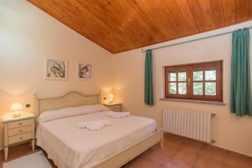 En eller flere senge i et værelse på Casa Marina
