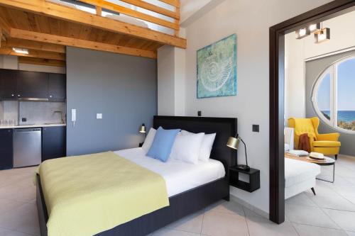 A bed or beds in a room at Diamond Kyparissia Suites