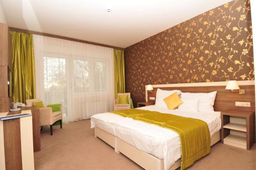 Ένα ή περισσότερα κρεβάτια σε δωμάτιο στο Hotel Európa Gunaras