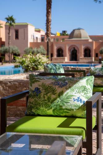 a chair with a pillow on top of a table at Jaal Riad Resort in Marrakech
