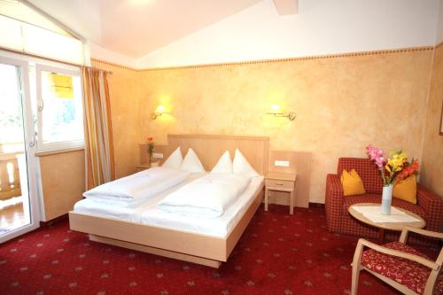 Una cama o camas en una habitación de Hotel Steiger