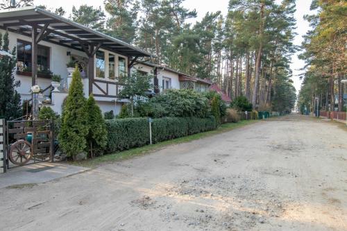 a house with a driveway next to a house at Ferienwohnung Timmy in Lubmin
