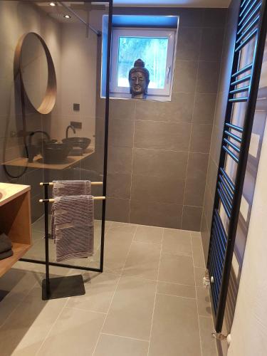 a bathroom with a shower and a sink and a window at Lieblingsplatz - Ski in und Ski out in See