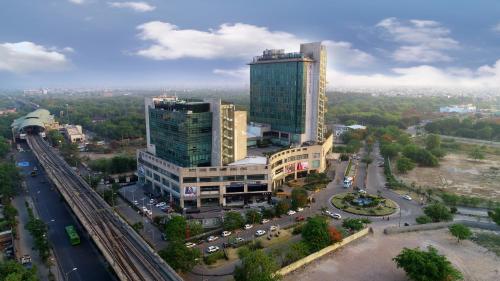 an aerial view of a city with a tall building at Crowne Plaza New Delhi Rohini by IHG in New Delhi