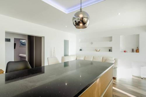 a kitchen with a black counter top in a room at Luxury apartment Martinis with pool in Split