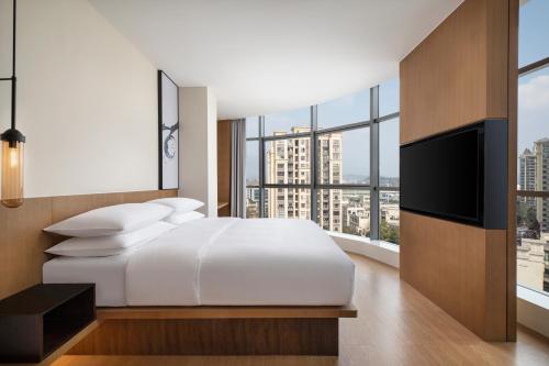 Ένα ή περισσότερα κρεβάτια σε δωμάτιο στο Fairfield by Marriott Chongqing Yongchuan