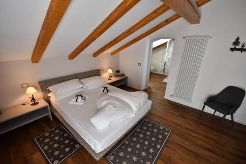 Postel nebo postele na pokoji v ubytování Maison Boutique Fior d'Alpe