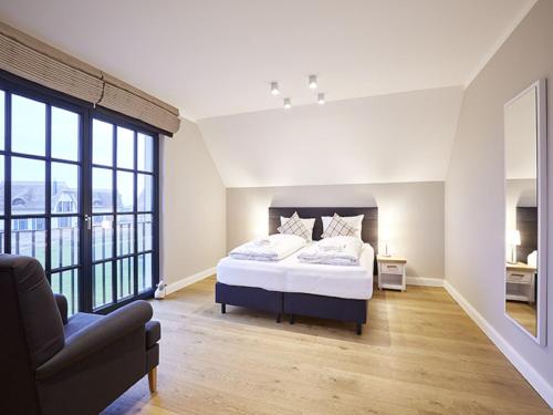 Voodi või voodid majutusasutuse Reetland am Meer - Superior Reetdachvilla mit 2 Schlafzimmern F16 toas