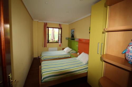 Posteľ alebo postele v izbe v ubytovaní Apartamento en complejo residencial Rovacias