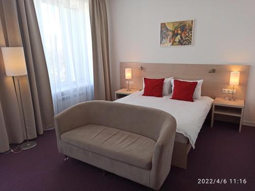 
Кровать или кровати в номере Лофт Отель
