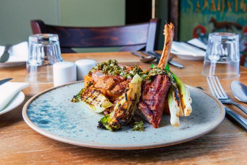 a plate of food on a wooden table at Staunton Arms in Staunton in the Vale