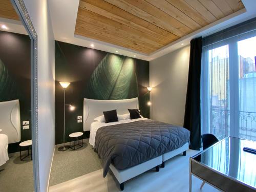Postel nebo postele na pokoji v ubytování Residenze Romano Ristorante & SPA albergo diffuso - WHITE