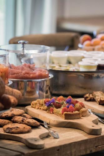 a table with cookies and other food on it at Domaine de Fontenille in Lauris