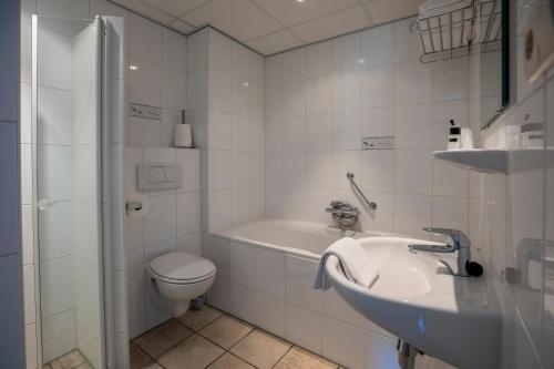 Een badkamer bij Hotel Tesselhof