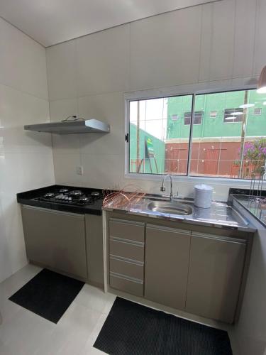 Kuchyň nebo kuchyňský kout v ubytování Penhasco Residences