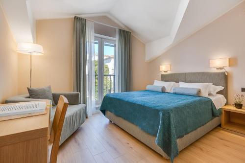 Postel nebo postele na pokoji v ubytování Residence Bepi Malugio