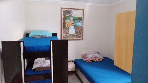 מיטה או מיטות בחדר ב-Pousada Expominas