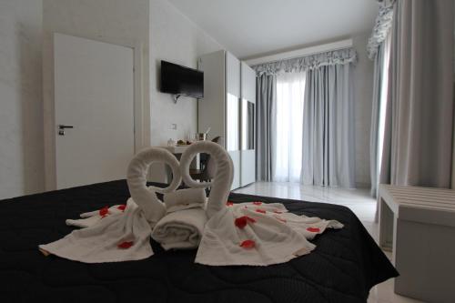 Televízia a/alebo spoločenská miestnosť v ubytovaní Hotel Presidente