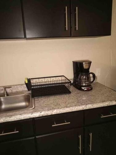 a kitchen counter with a mixer and a sink at Otay Studio great patio near Otay Crossing & Airport in Tijuana
