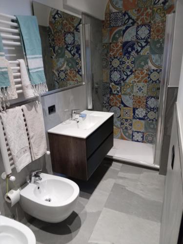 a bathroom with a sink and a toilet and a shower at TakeAmalfiCoast Main House in Minori