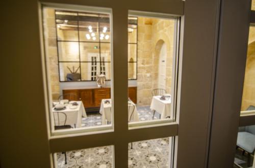 a view of a room through a window at Senglea Suites in Senglea