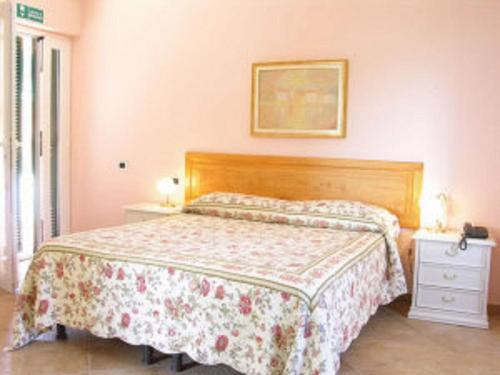 Postel nebo postele na pokoji v ubytování B&B Agriturismo Regno di Toscana