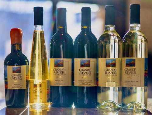 a group of wine bottles sitting on a table at Wine Country Inn in Palisade